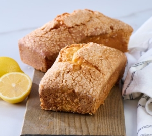 Baked whole loaf cakes on rustic wooden background Baked whole loaf cakes on rustic wooden background